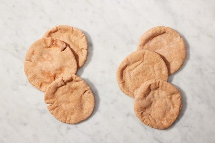 Two types of baked pita next to each, one with noticeable cracks